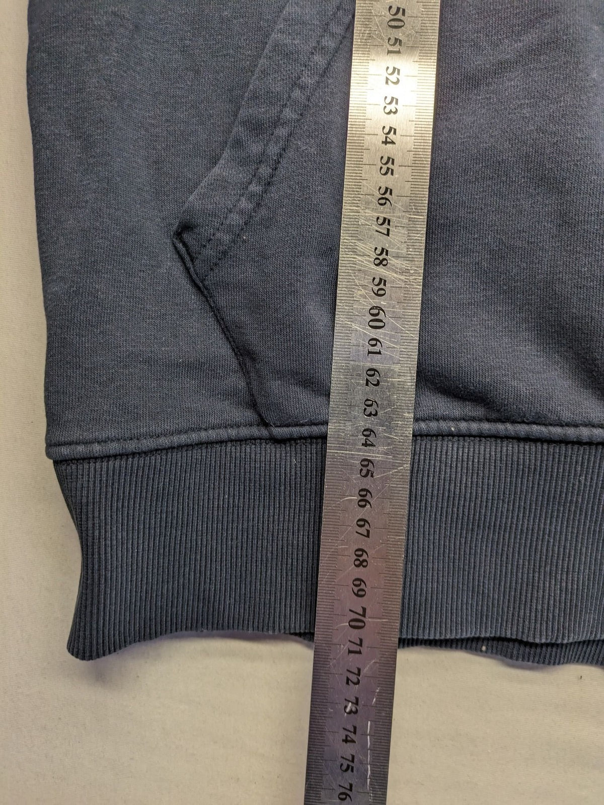 Quiksilver grey hoodie with logo graphic, kangaroo pocket, and adjustable hood.