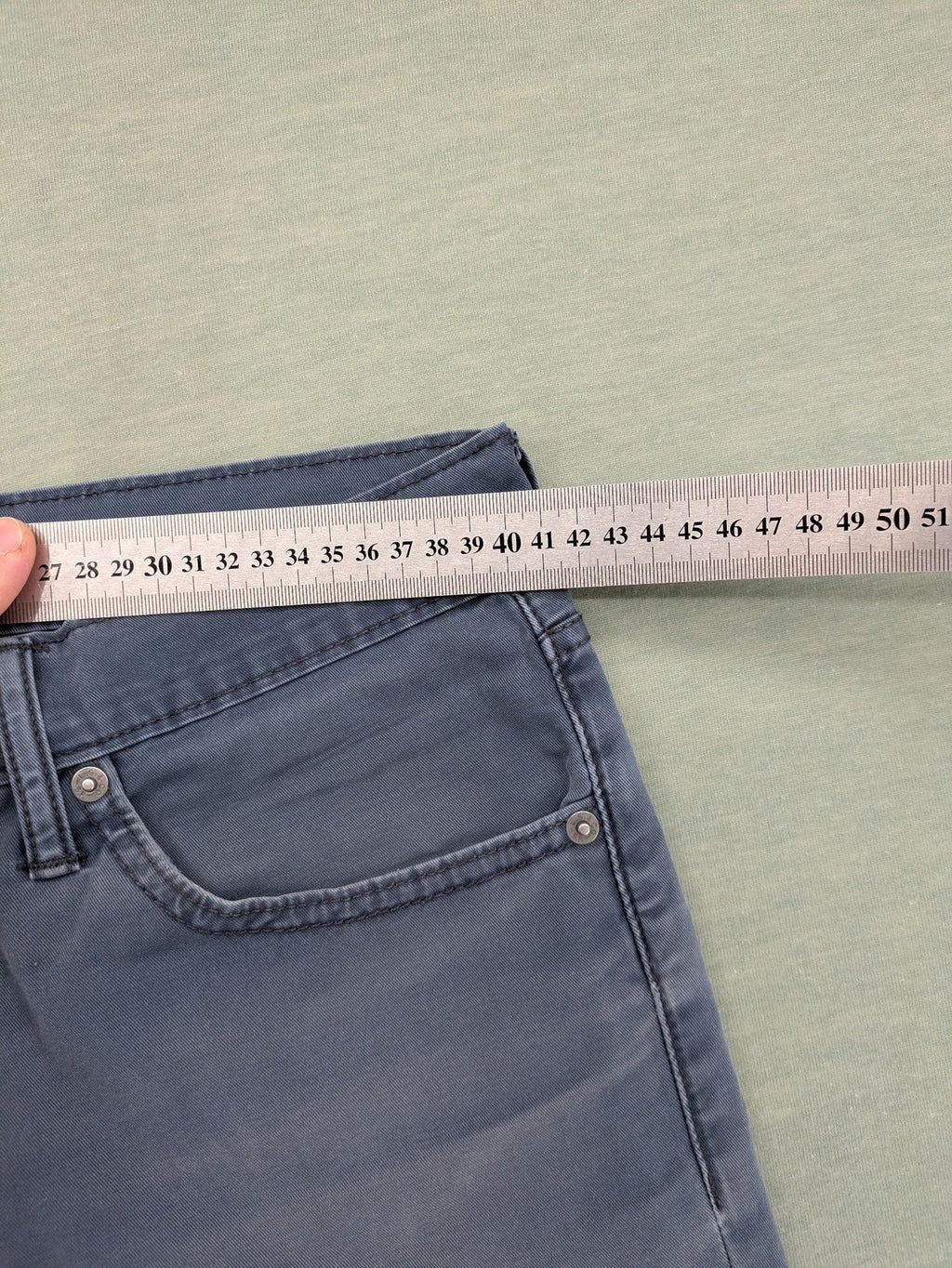 Levi's blue slim fit jeans with faded wash and classic 5-pocket design.