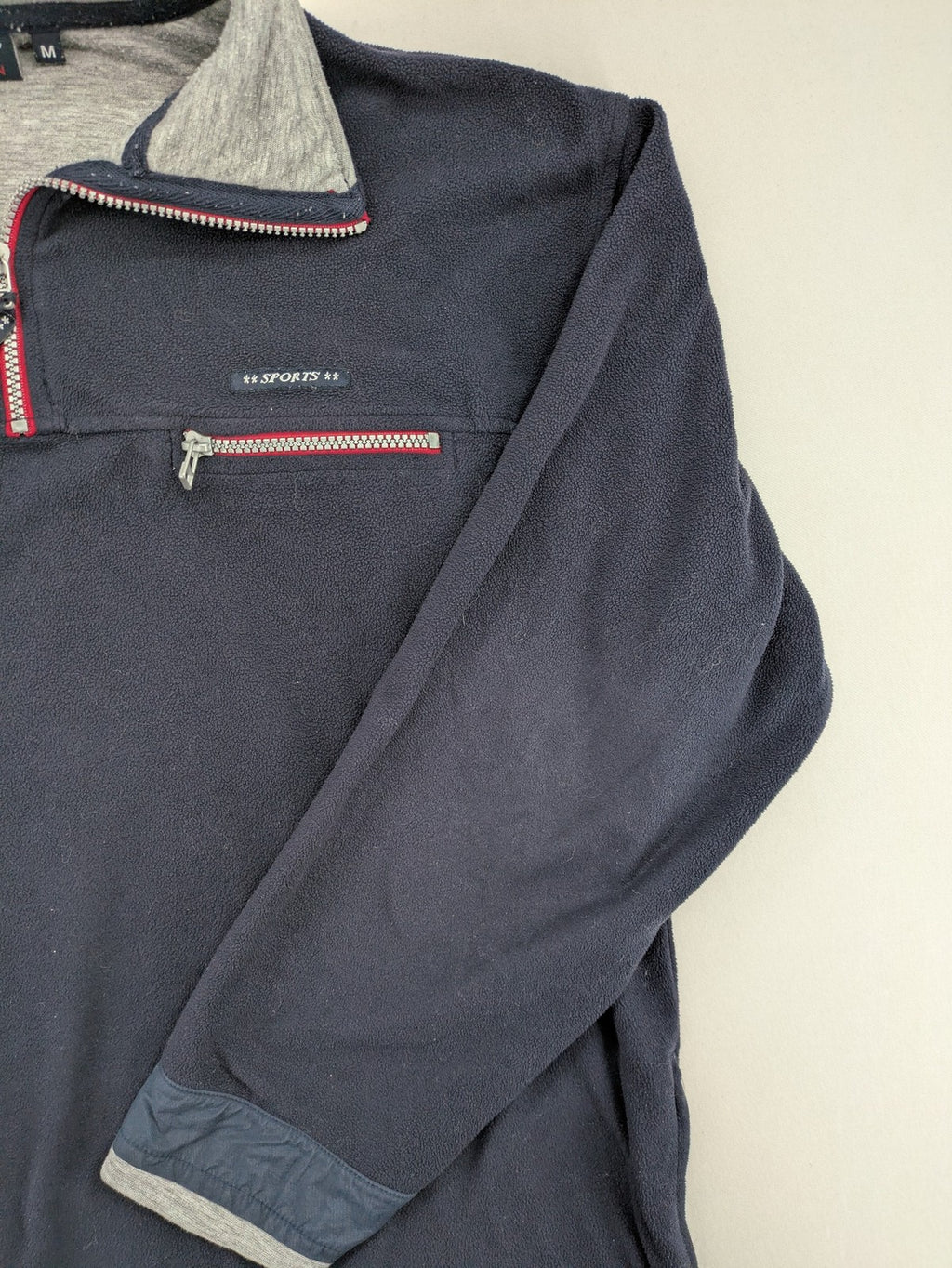 Sport Division turtle neck jumper dark blue fleece with quarter zip and chest pocket.