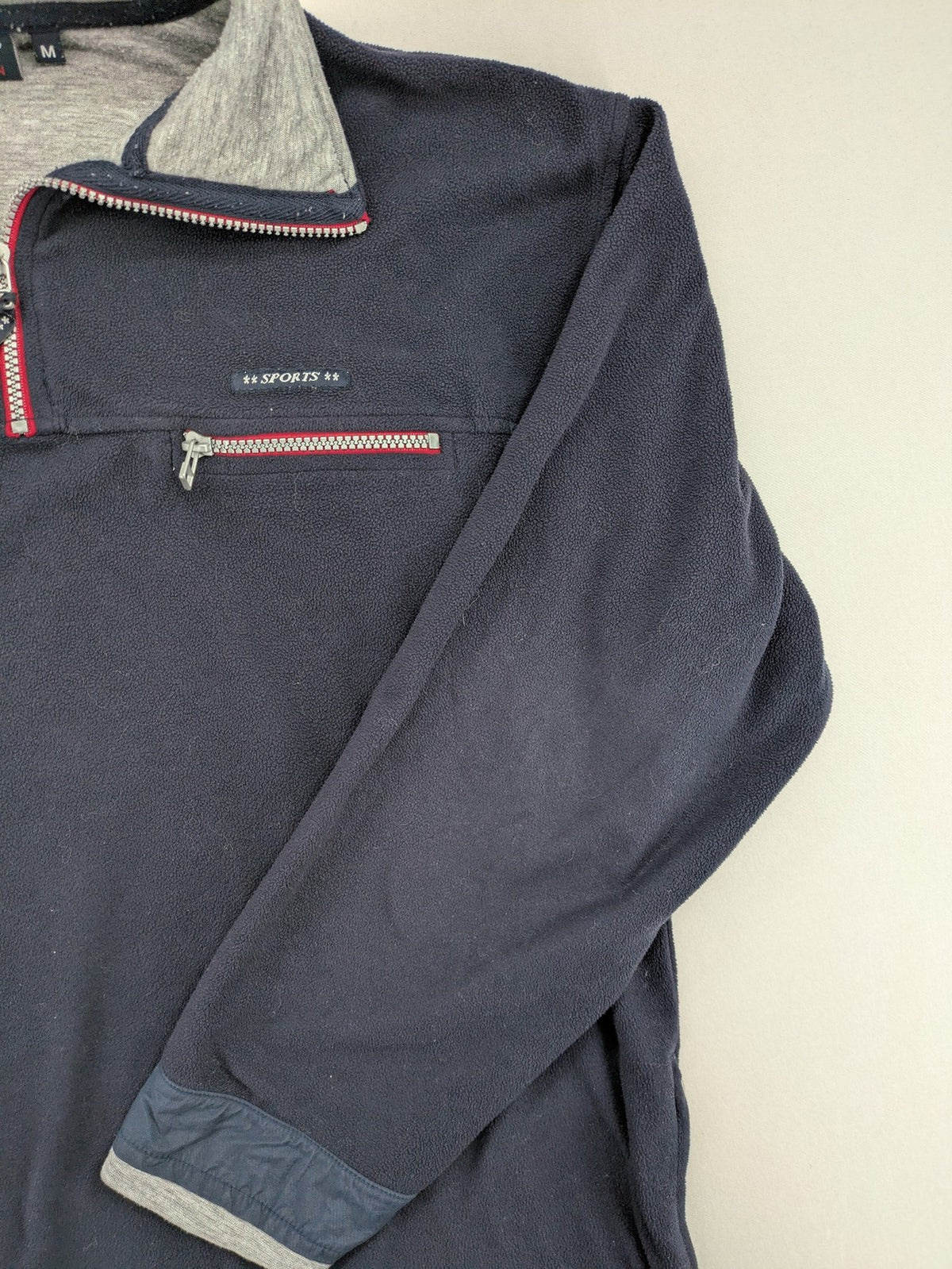 Sport Division turtle neck jumper dark blue fleece with quarter zip and chest pocket.