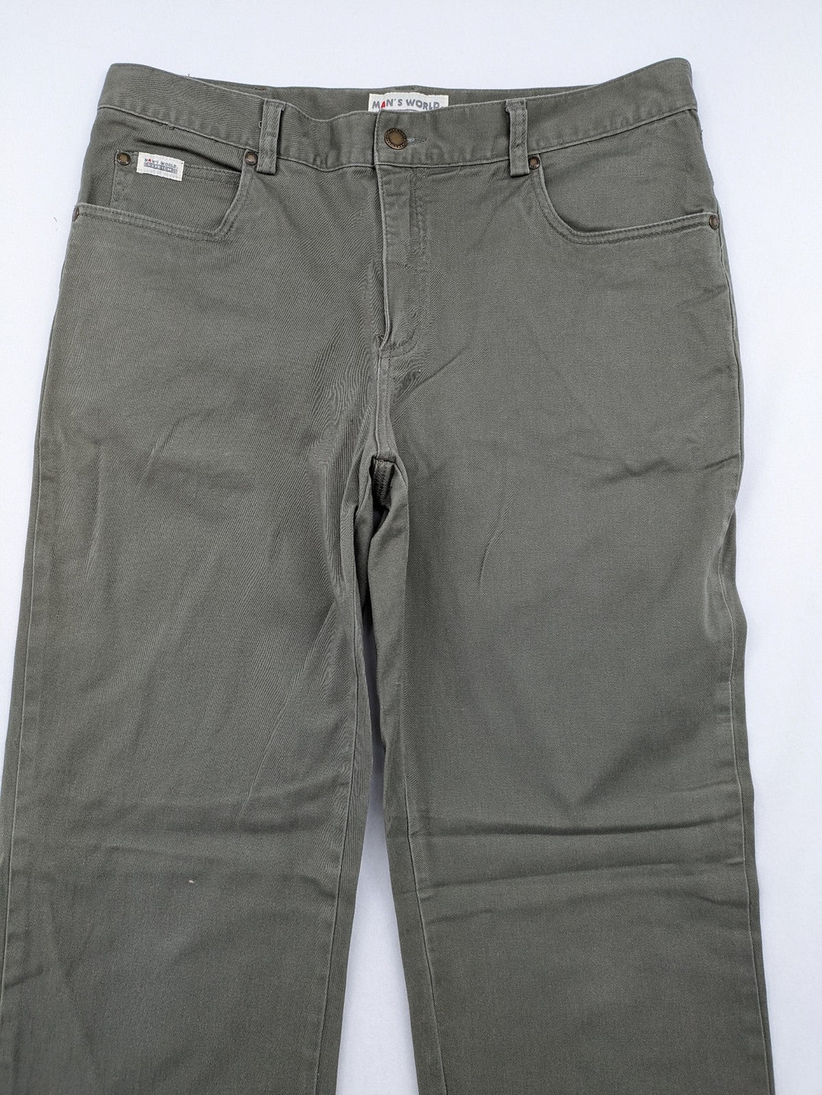 Man's World khaki chino pants with button and zipper closure, made from cotton-elastane blend.