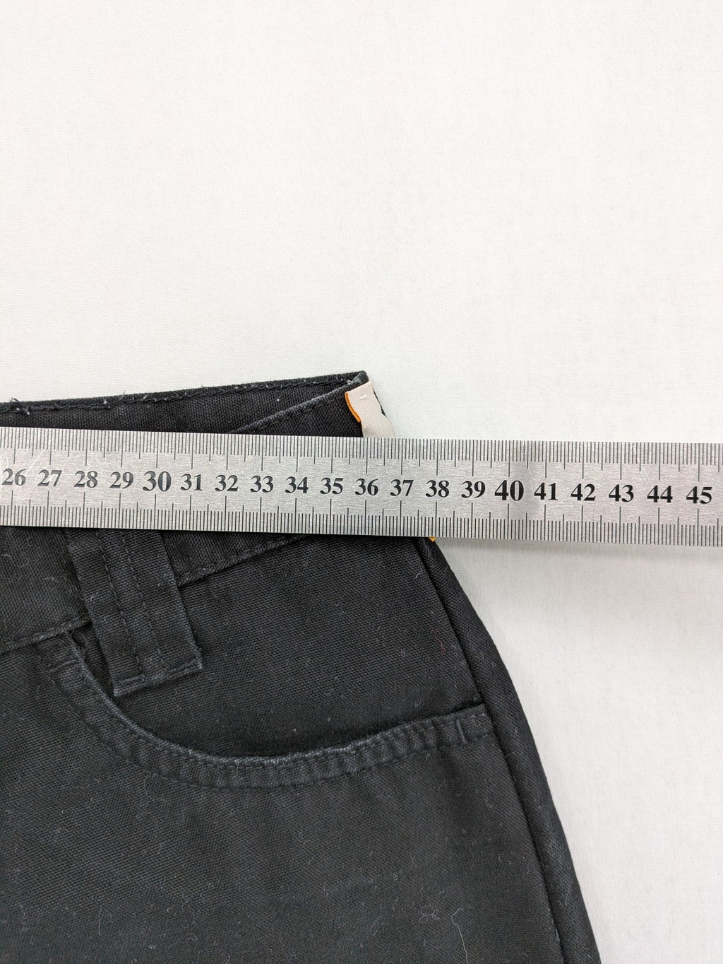 Vunic black cargo pants high-waisted straight leg cotton with zipper and button closure.