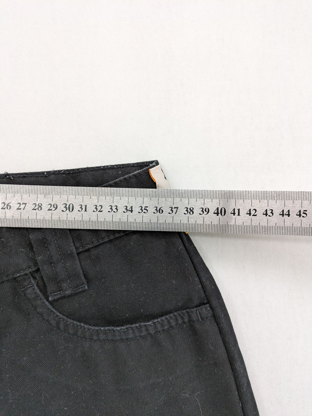 Vunic black cargo pants high-waisted straight leg cotton with zipper and button closure.