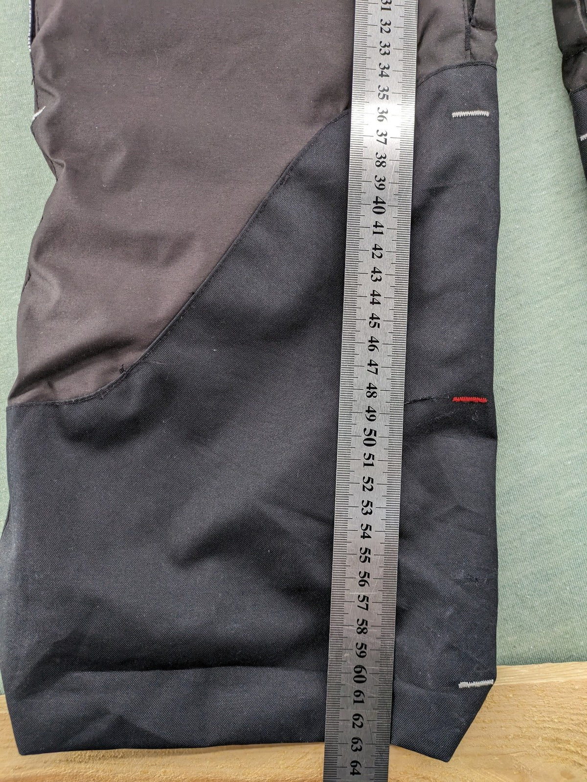 Wed'ze black ski pants with adjustable waistband, zip pockets, and Pull'n'Fit system.