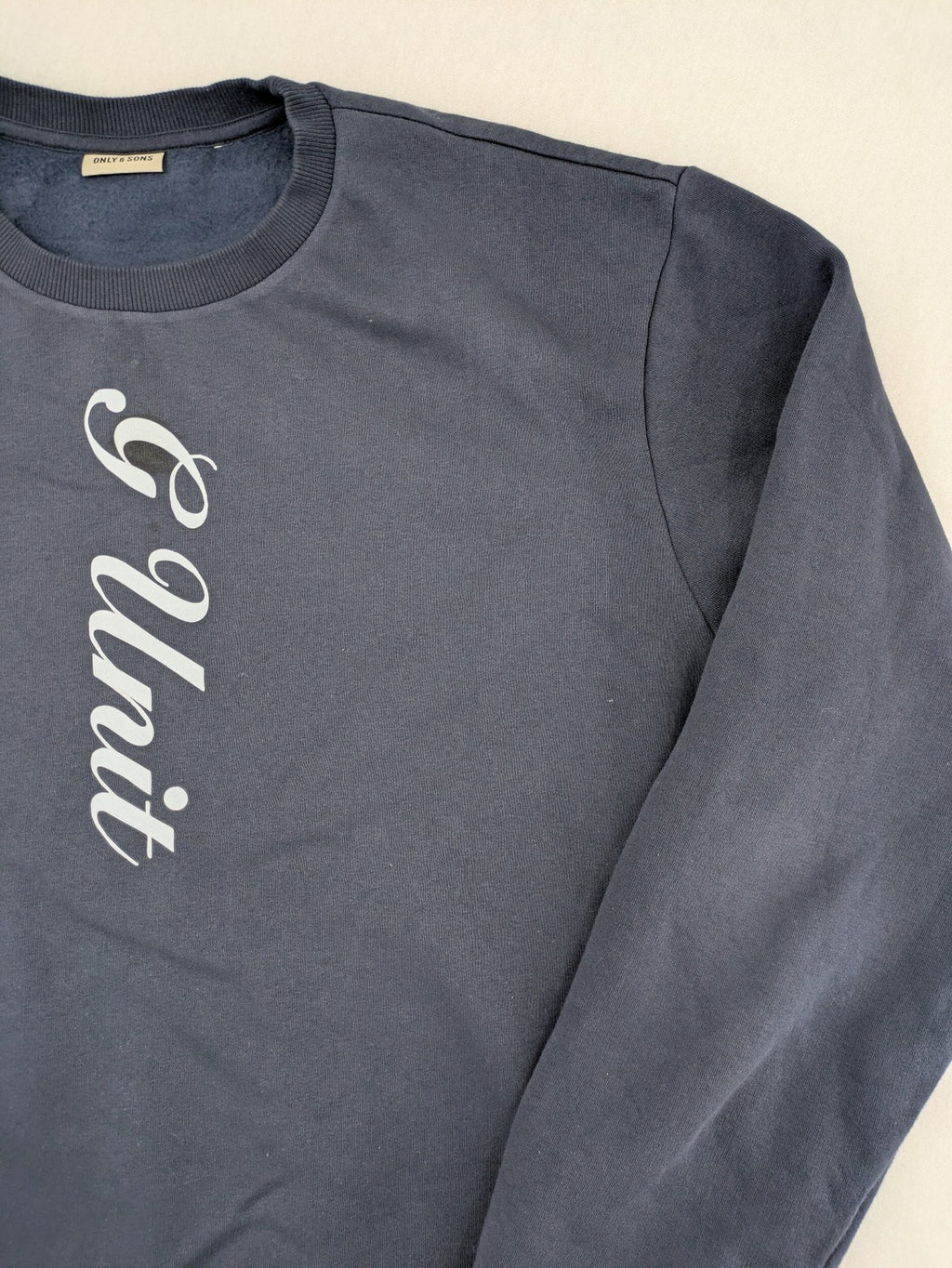 G-Unit navy turtle neck jumper with vertical logo graphic and soft fleece interior.