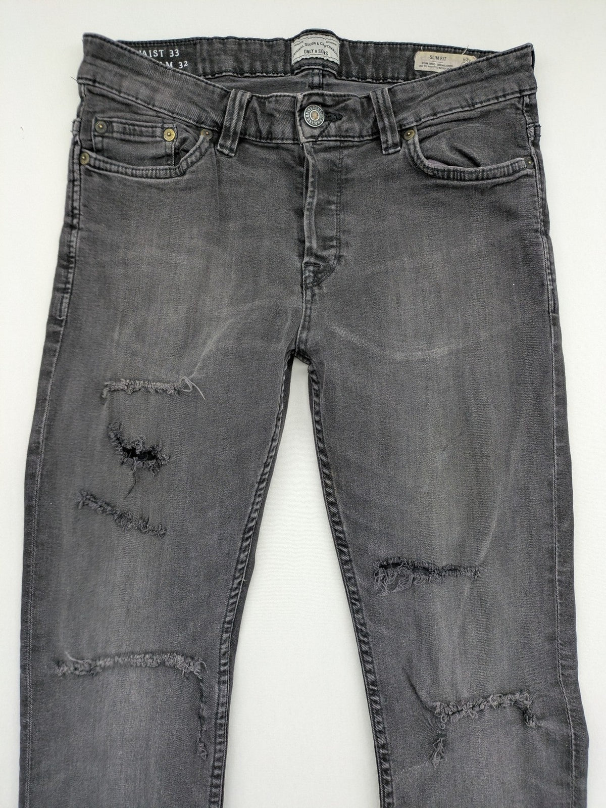 Only & Sons grey slim fit jeans with ripped details and open hem, stretch denim.
