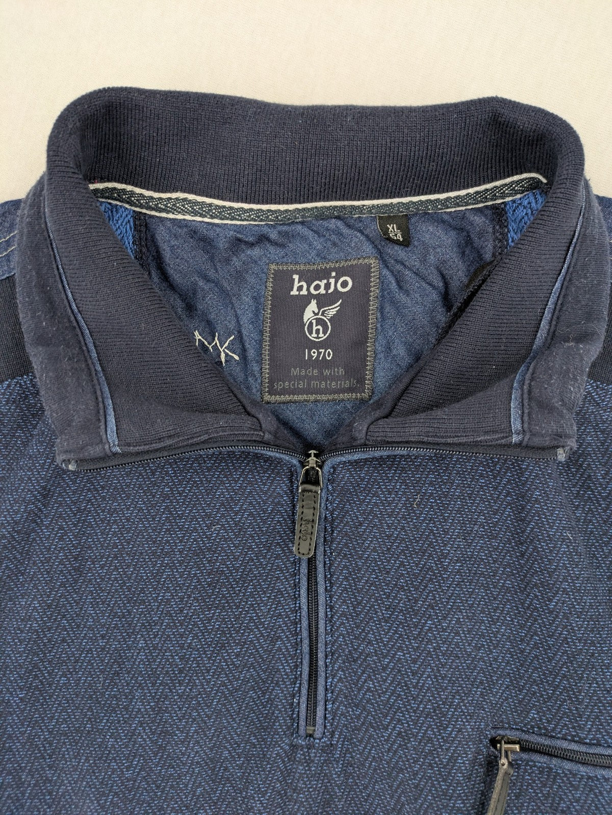 Hajo navy turtle neck jumper with herringbone pattern, zip collar, and chest pocket.