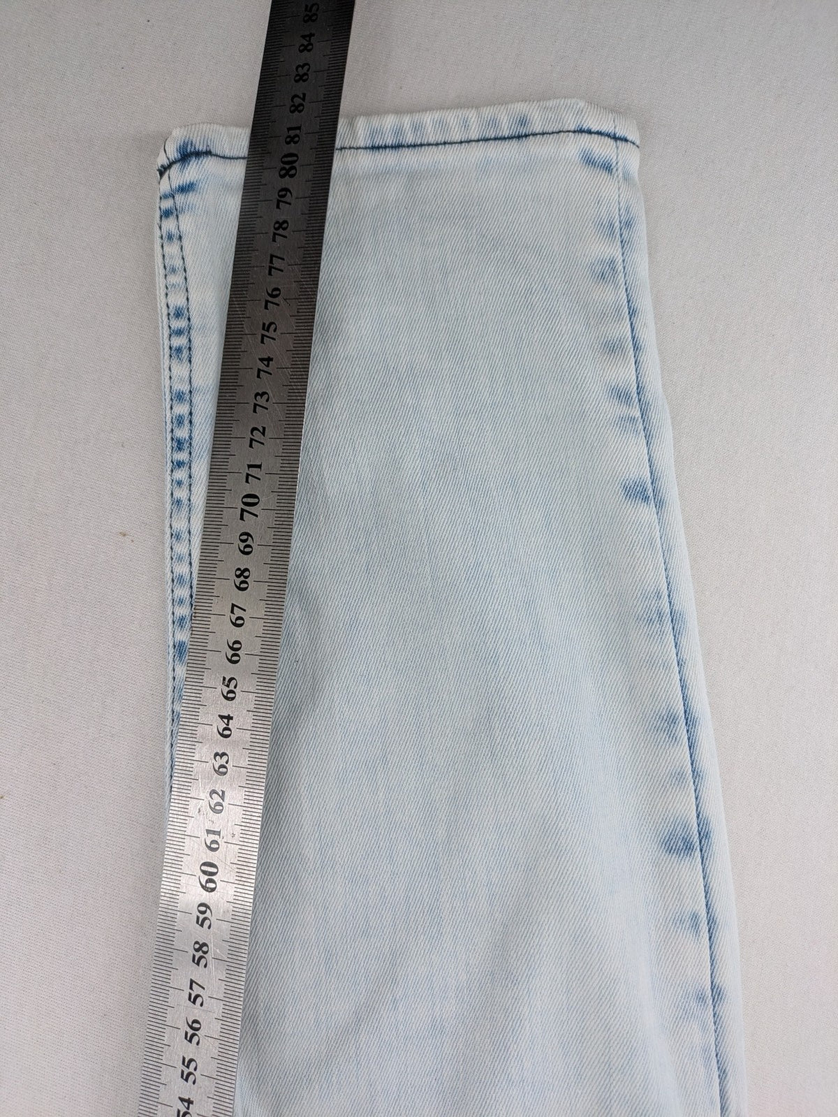 Drykorn blue slim fit jeans with acid wash and leather logo patch.