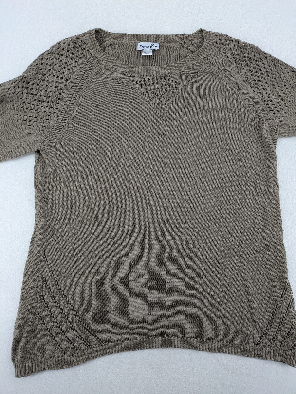 Dressin brown knit jumper with decorative open-knit details and comfortable fit.