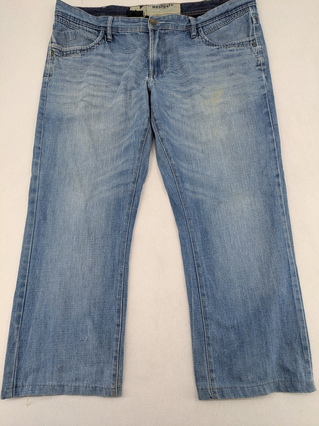 C&A blue straight jeans 5-pocket style with logo and button closure.