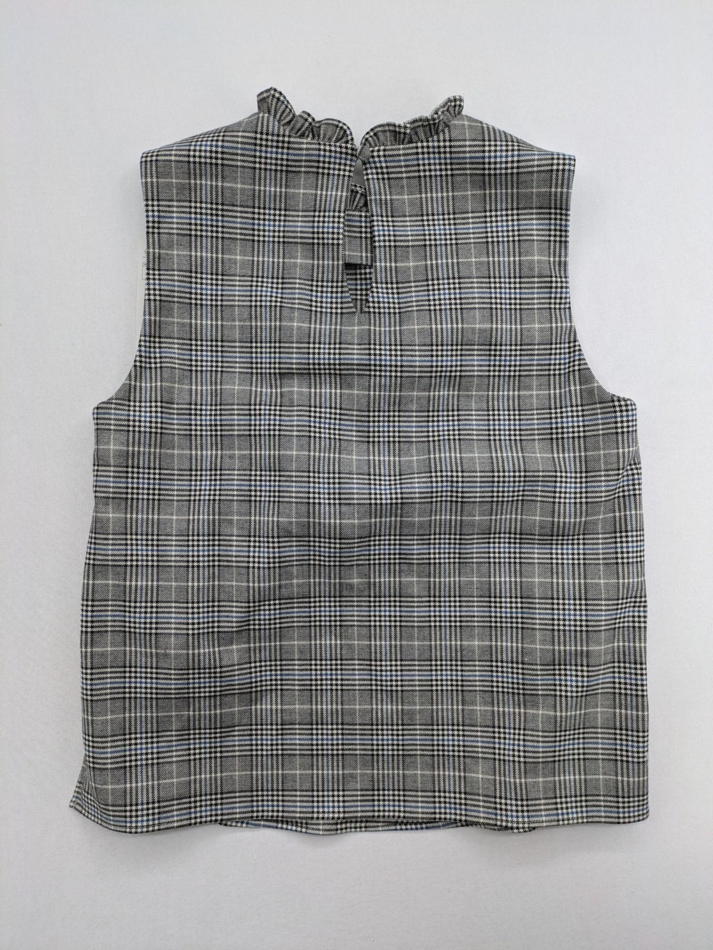 Zara ruffled sleeveless blouse grey check pattern high ruffle collar with blue, black, white accents