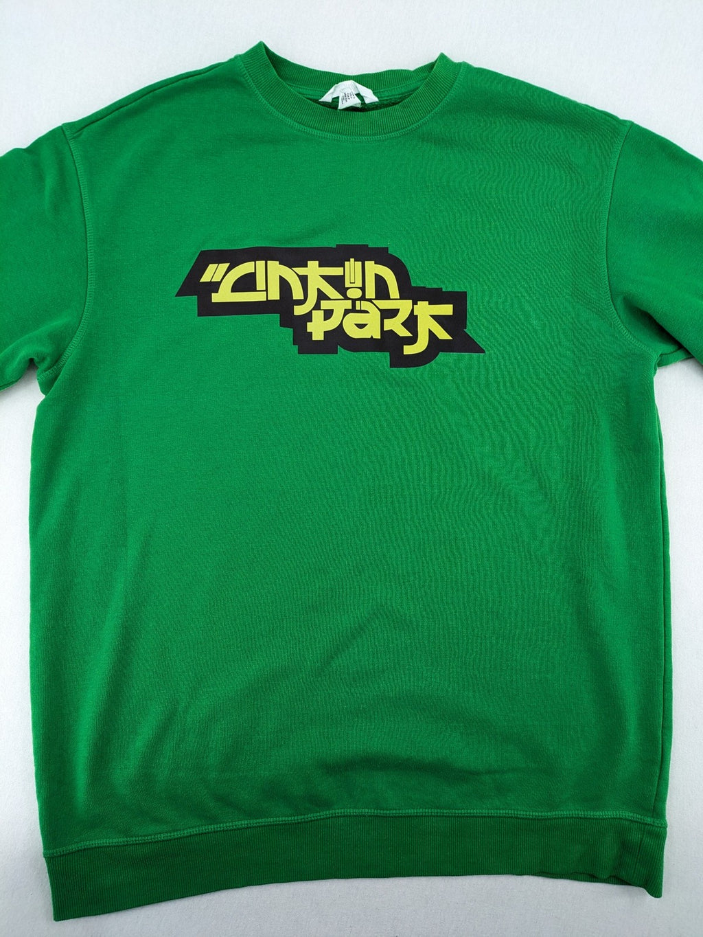 Linkin Park green sweatshirt featuring iconic band logo and classic crew neck design.