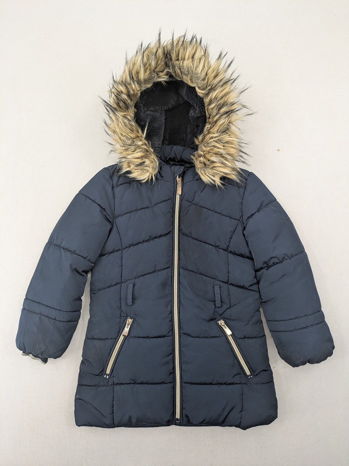 GEF cream coat with quilted design, fleece-lined hood, and faux fur trim.
