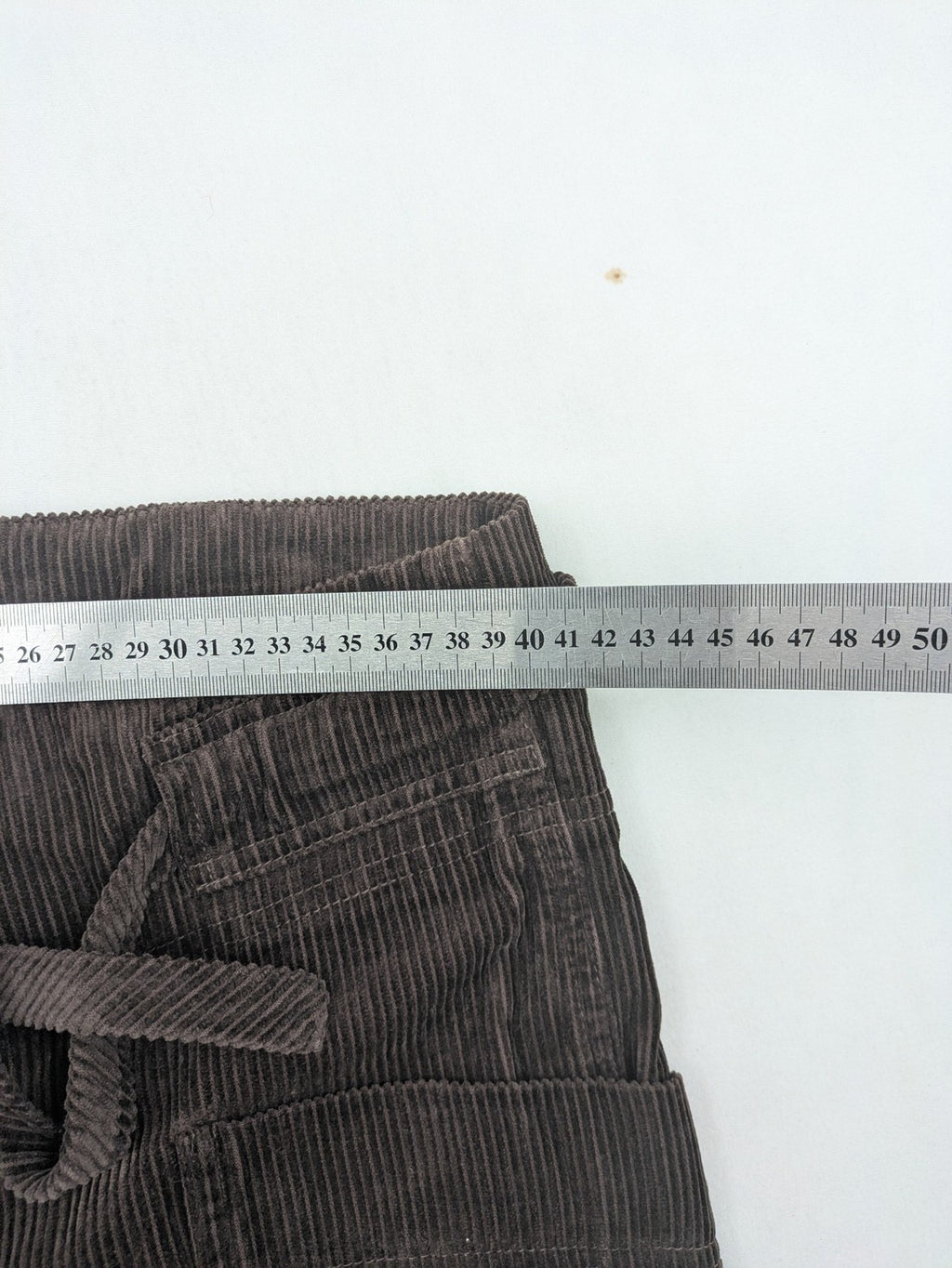 Alma & Lovis brown cord pants paperbag style with belt, made from organic cotton.