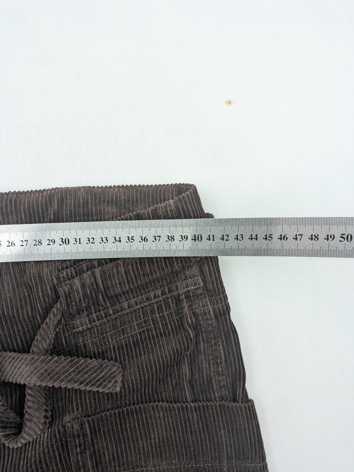 Alma & Lovis brown cord pants paperbag style with belt, made from organic cotton.