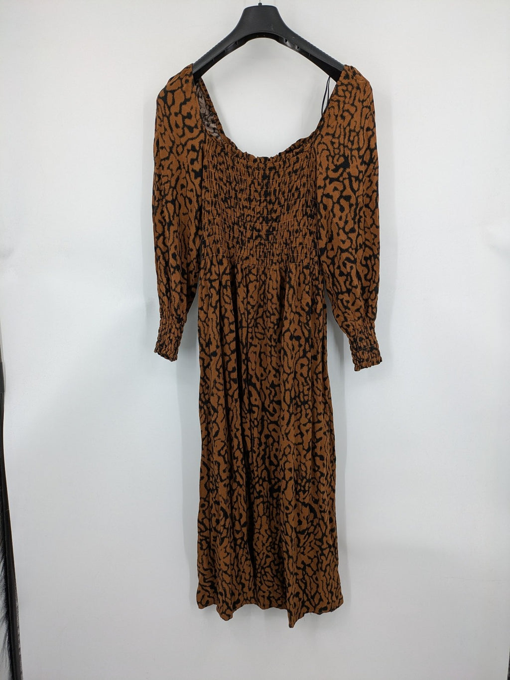 H&M brown and black animal print midi dress with smocked bodice and square neckline.