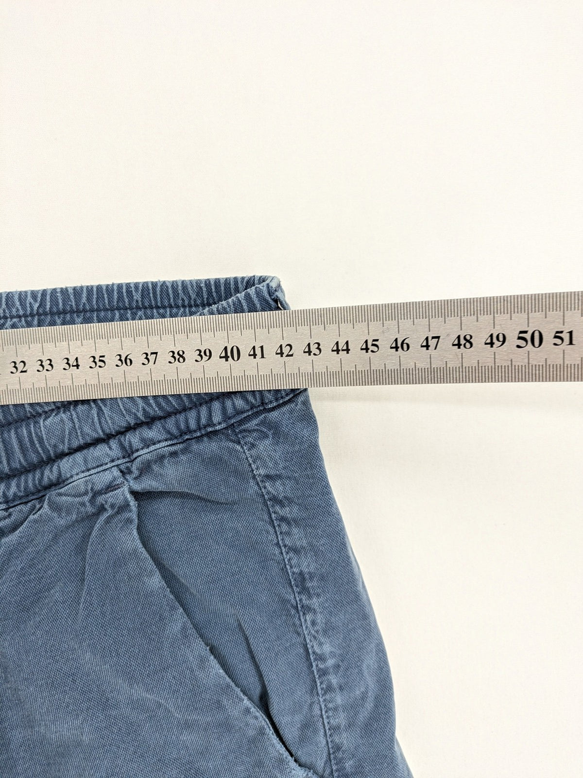 Spaghetti Mafia cream pants with elastic waistband, drawstring, and subtle front pleats.
