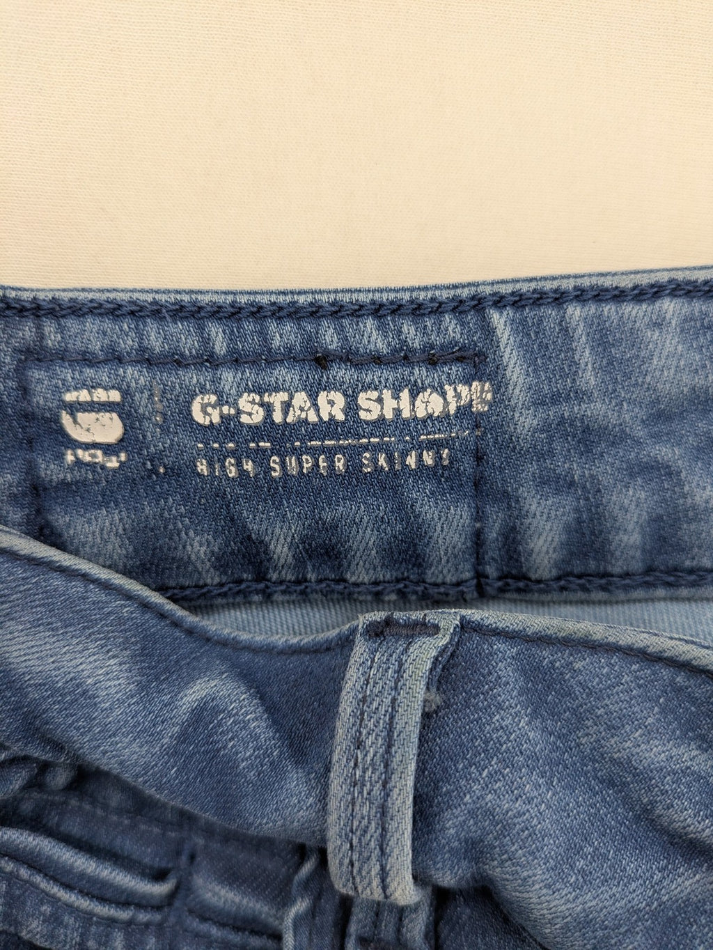G-Star Raw blue high super skinny jeans with medium wash and logo details.
