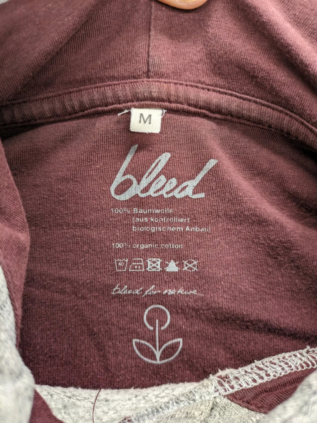 Bleed turtle neck jumper grey burgundy colorblock design with adjustable hood and kangaroo pocket.