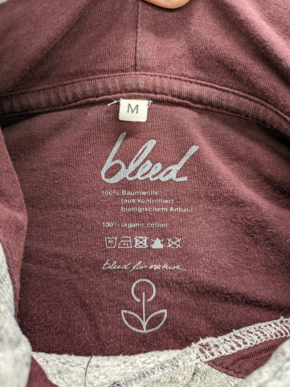 Bleed turtle neck jumper grey burgundy colorblock design with adjustable hood and kangaroo pocket.