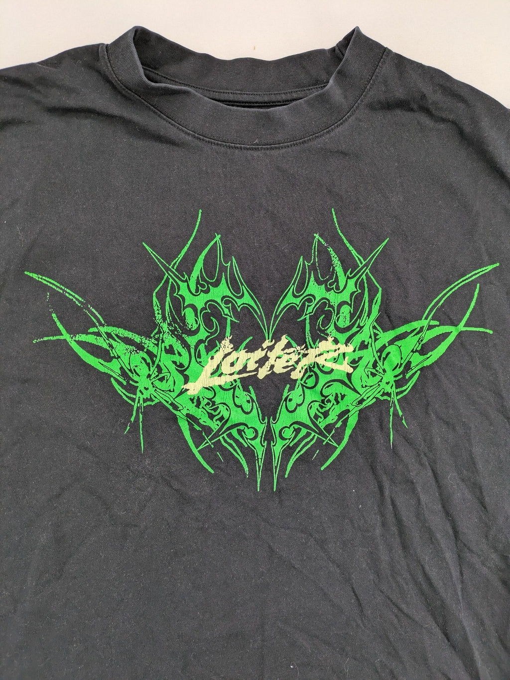 Lotter XL t-shirt black with neon green tribal graphic print on front and back.