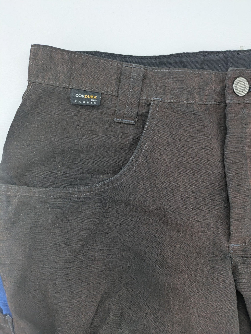 Kübler work pants blue grey Cordura fabric with multiple cargo pockets and reflective details.
