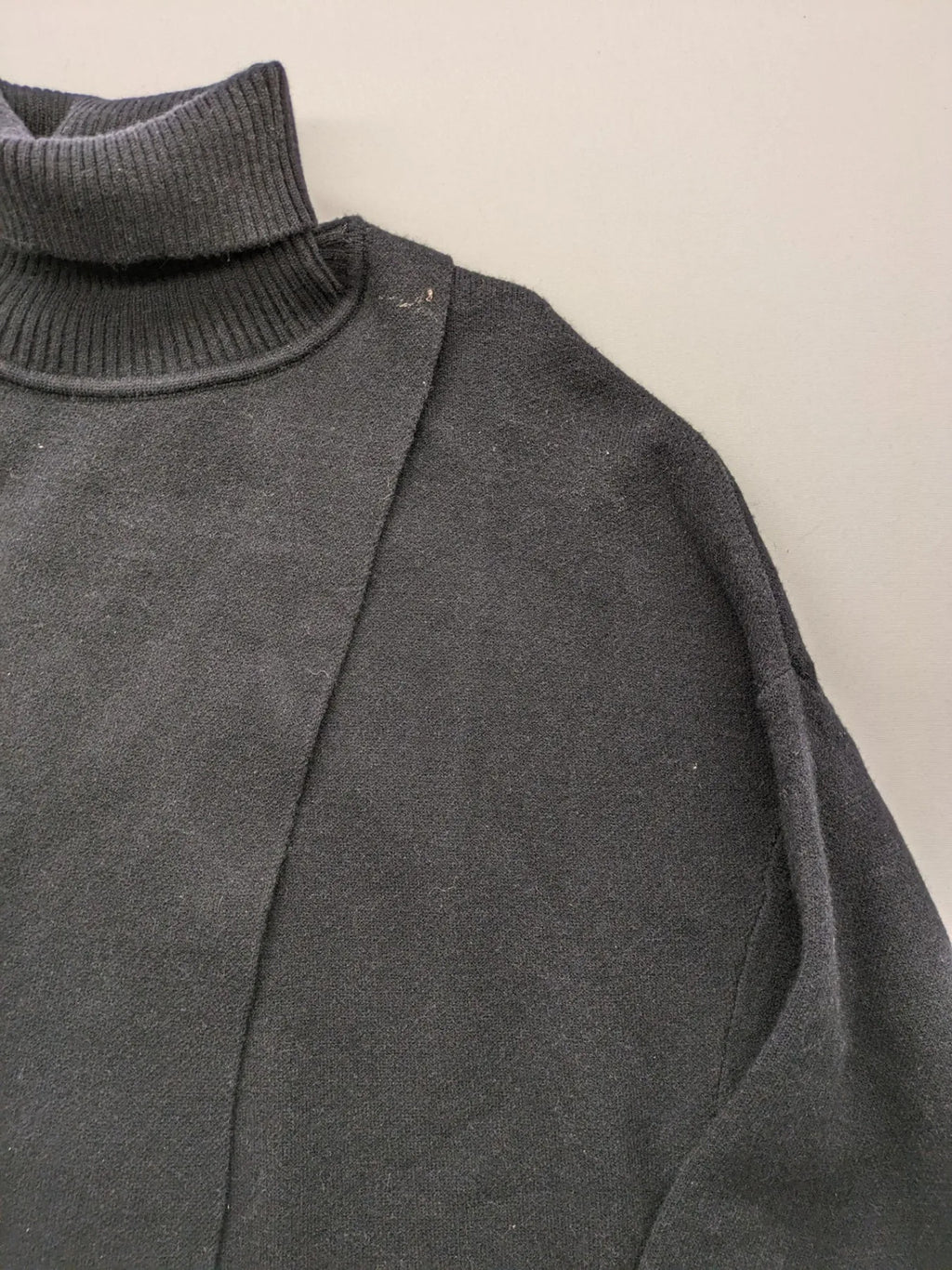 In Shape grey turtle neck jumper asymmetrical design, soft viscose blend material.