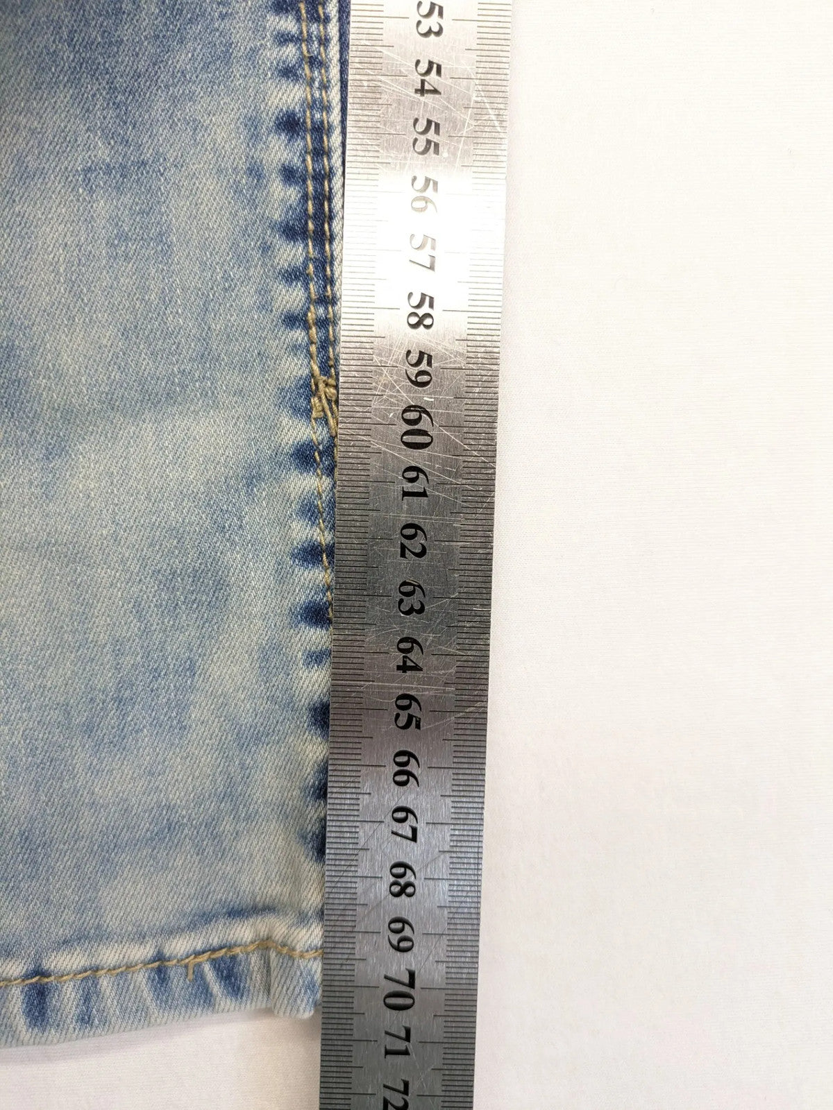 ONE LOVE DENIM blue straight jeans with distressed details and double button closure.