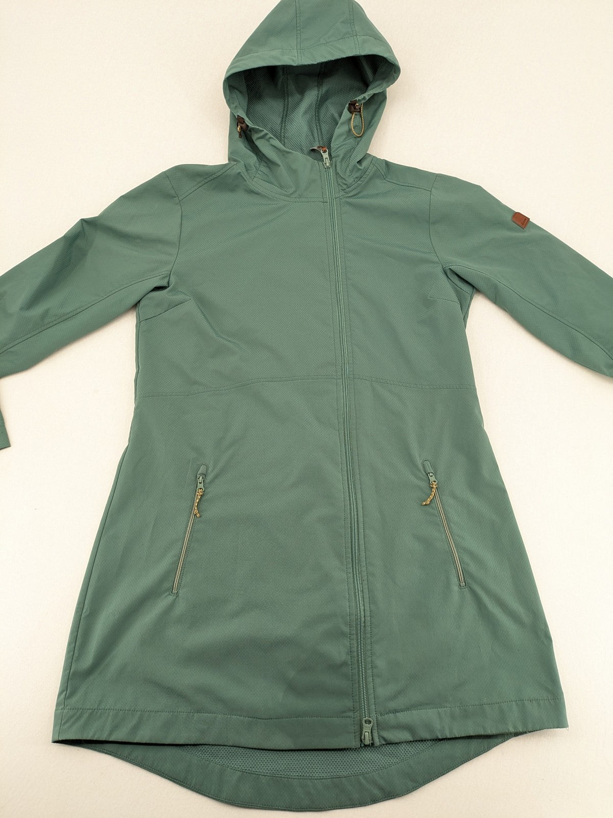 Frilufts green softshell jacket with hood, longline design, durable zipper, practical zip pockets.