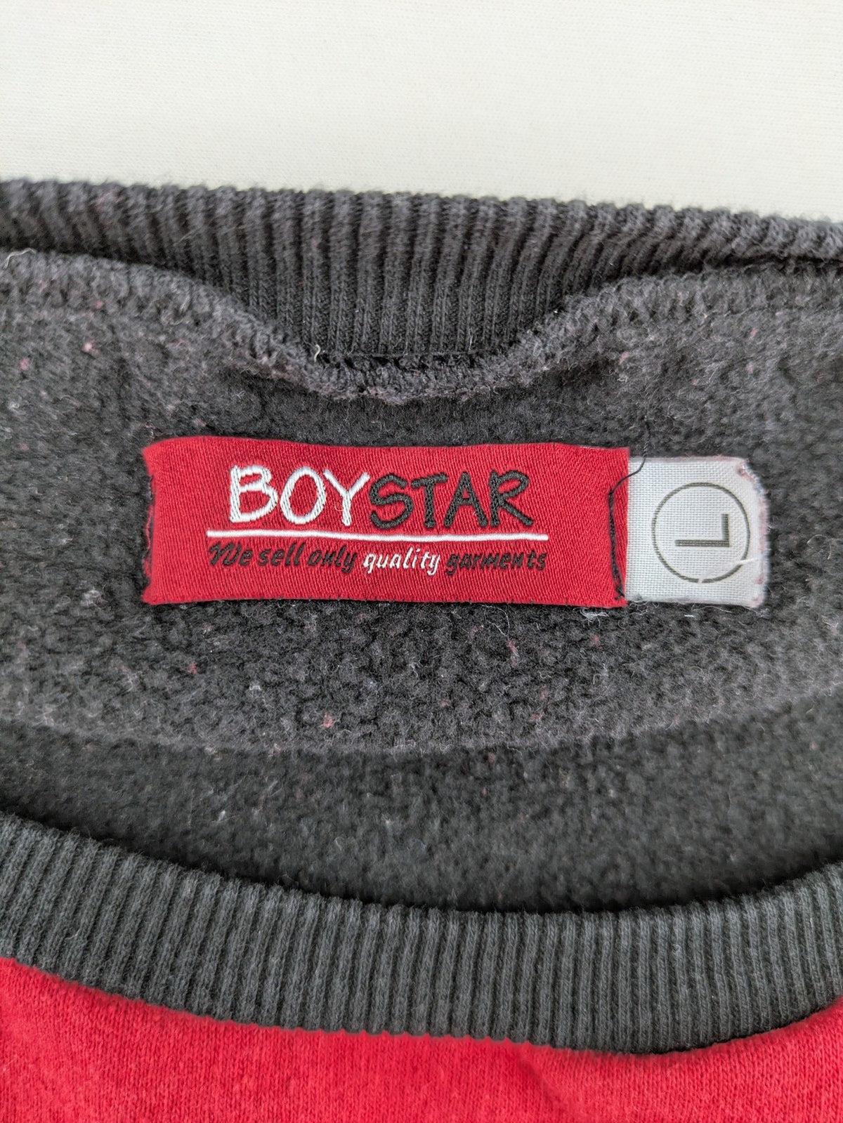 Boystar vintage turtle neck jumper red black colorblock with "MUST FREE YOUR BODY" graphic.