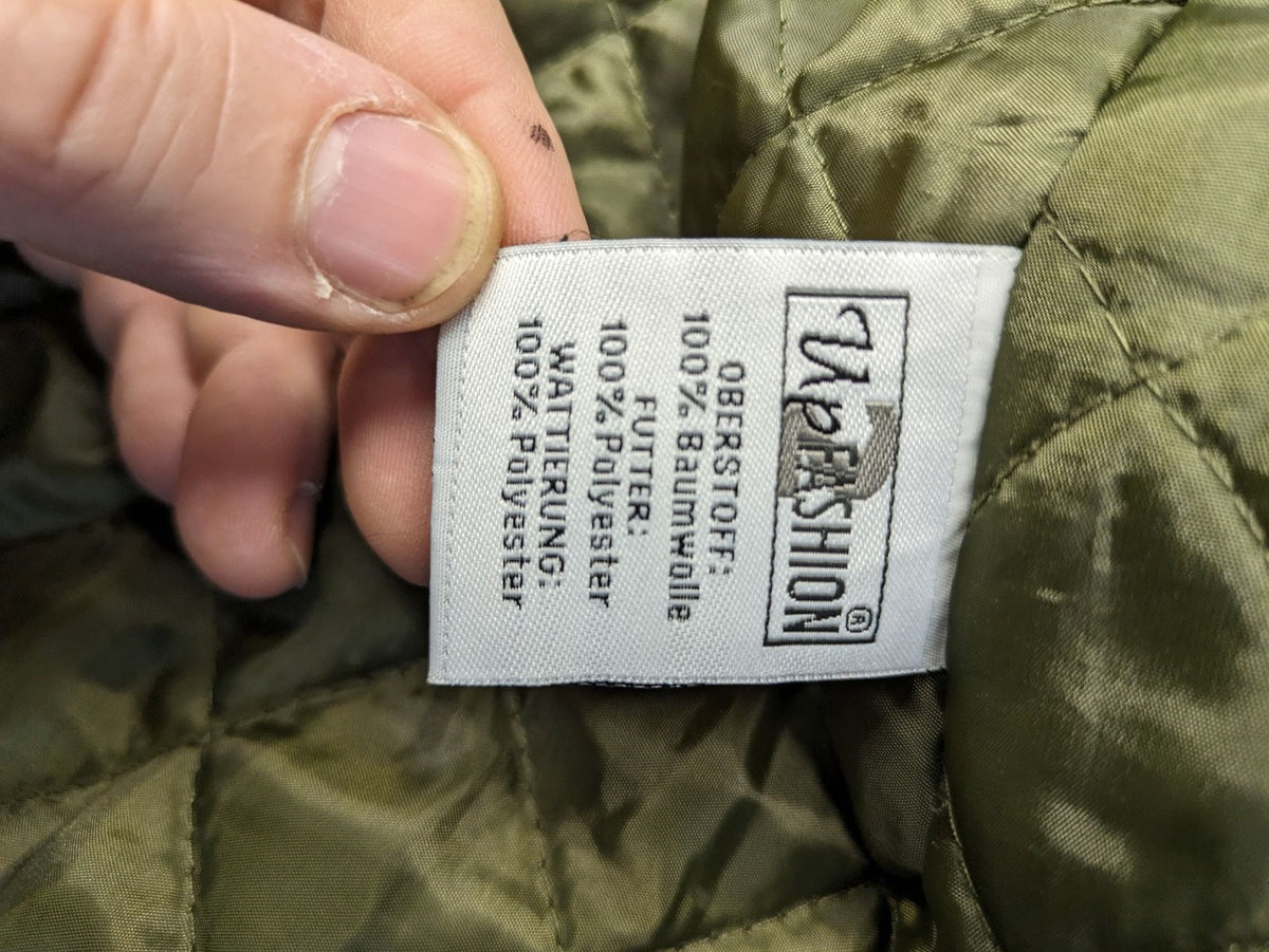 Vp Fashion khaki parka coat with "Bloomin' Lovely" floral embroidery and quilted lining.