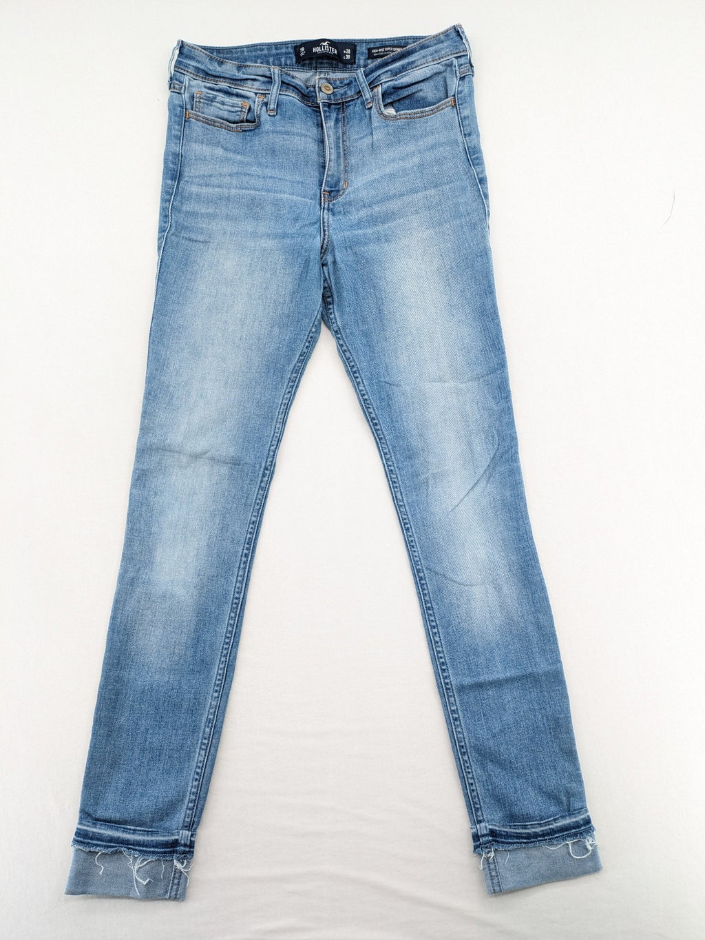 Hollister blue high rise super skinny jeans with frayed hem and classic stretch denim.
