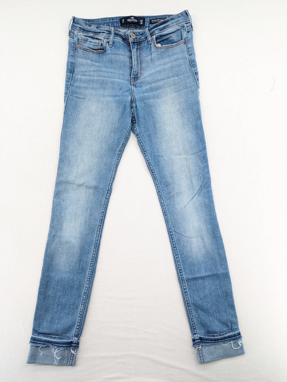 Hollister blue high rise super skinny jeans with frayed hem and classic stretch denim.