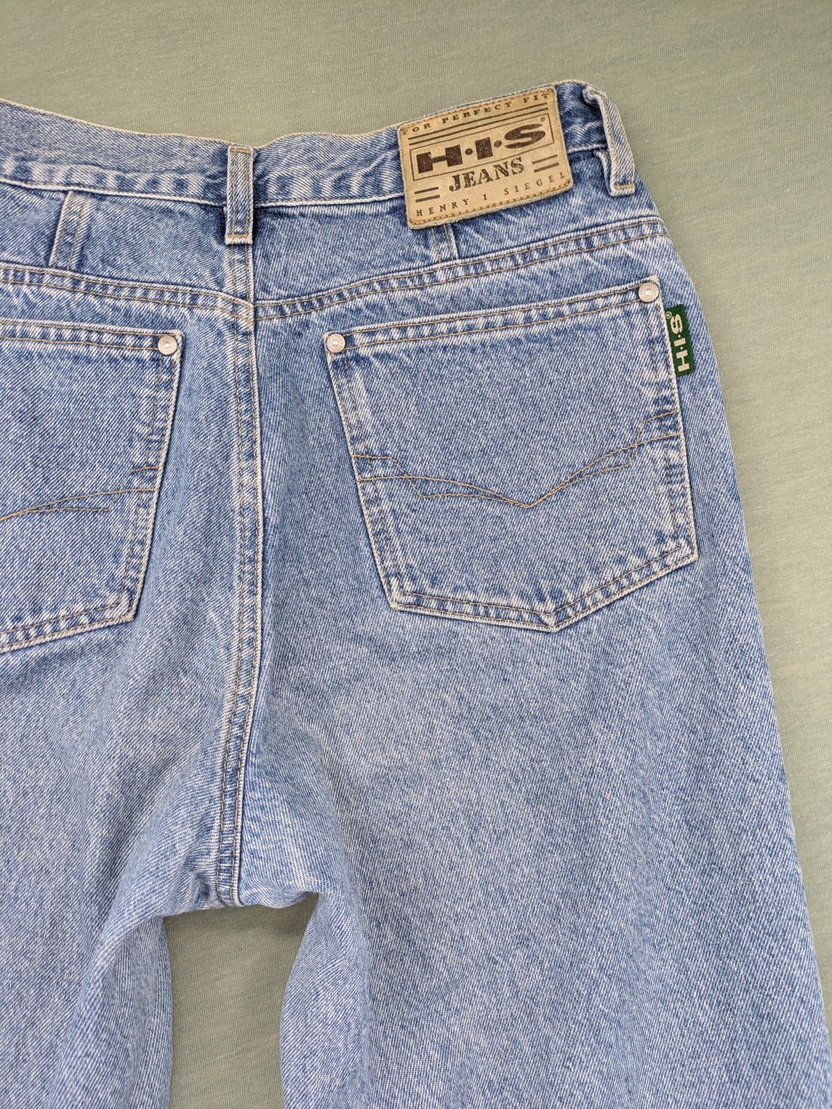 H.I.S blue mom jeans high waist vintage denim with classic 90s wash and straight cut.