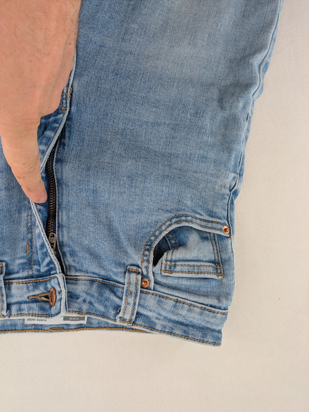 Bershka blue super high waist skinny jeans with washed denim finish and zip closure.