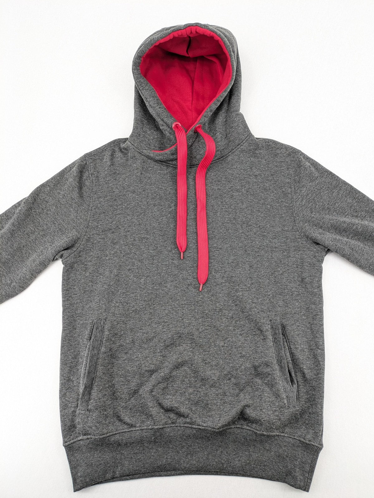 Bolf grey hoodie with pink contrast hood, kangaroo pocket, and ribbed cuffs.