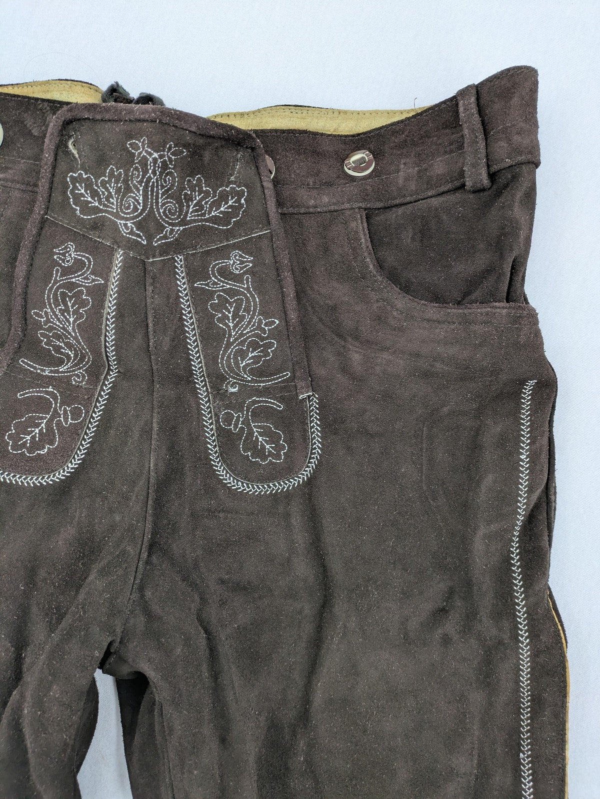 Braun traditional leather pants brown suede with intricate embroidery on bib and legs.