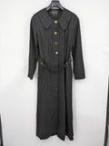 Alvina black trench coat with lace collar and gold buttons, belted waist design.