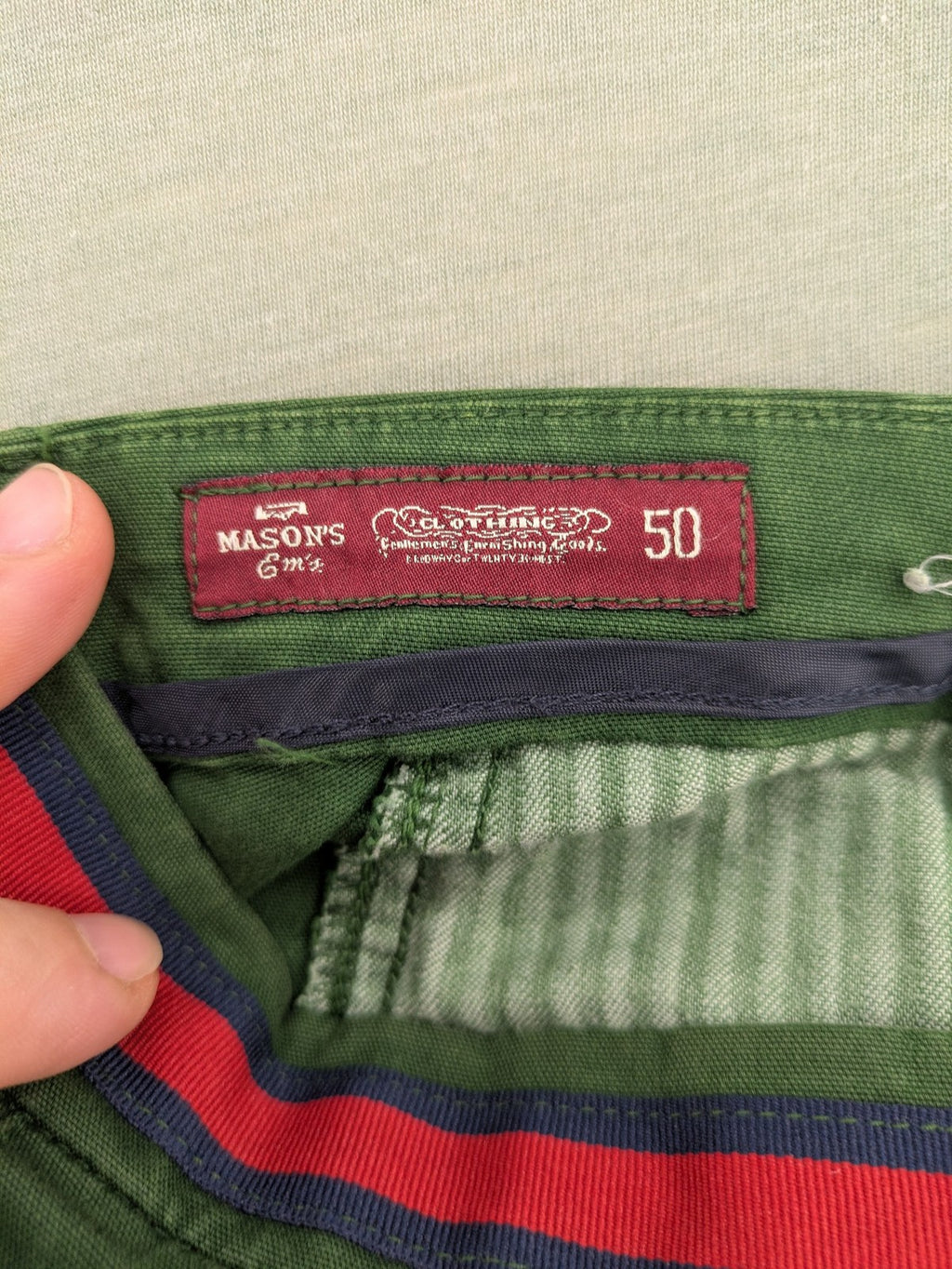 Mason's green chino pants with striped red and blue waistband, cotton stretch material.