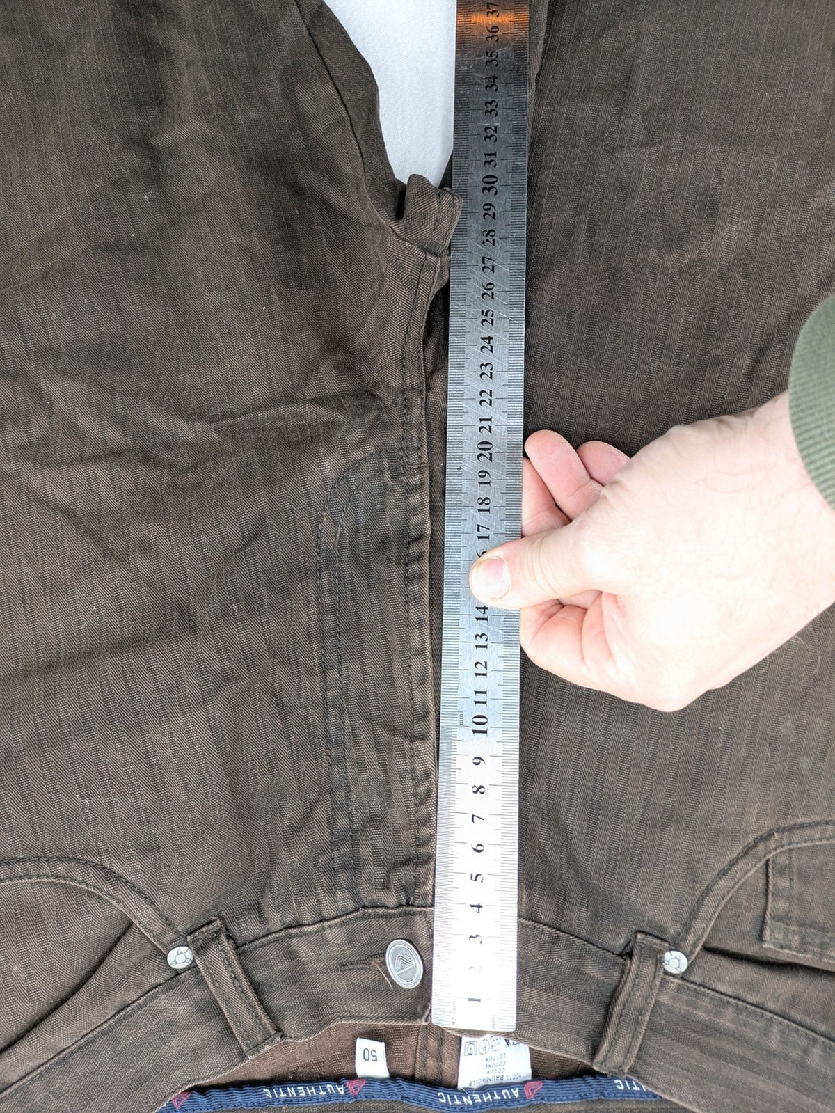 Authentic Clothing Company brown straight jeans with subtle stripe pattern and brand patch.