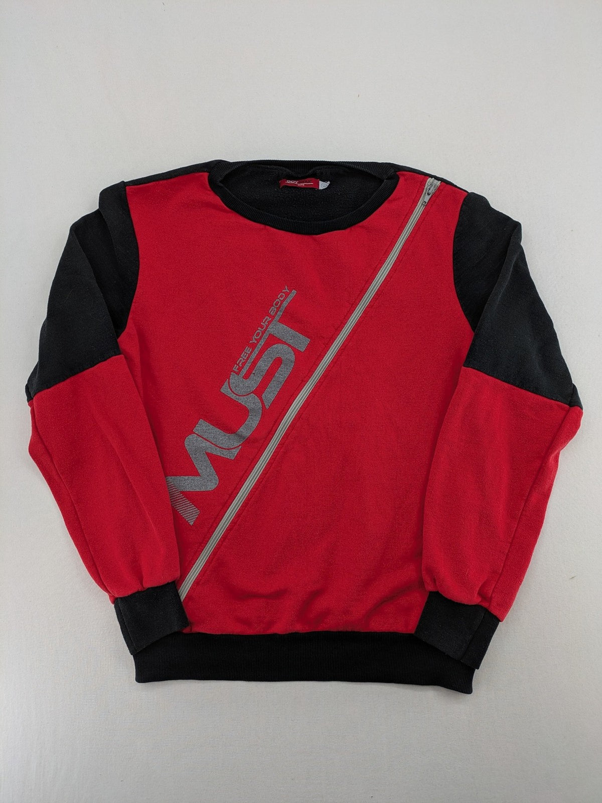 Boystar vintage turtle neck jumper red black colorblock with "MUST FREE YOUR BODY" graphic.