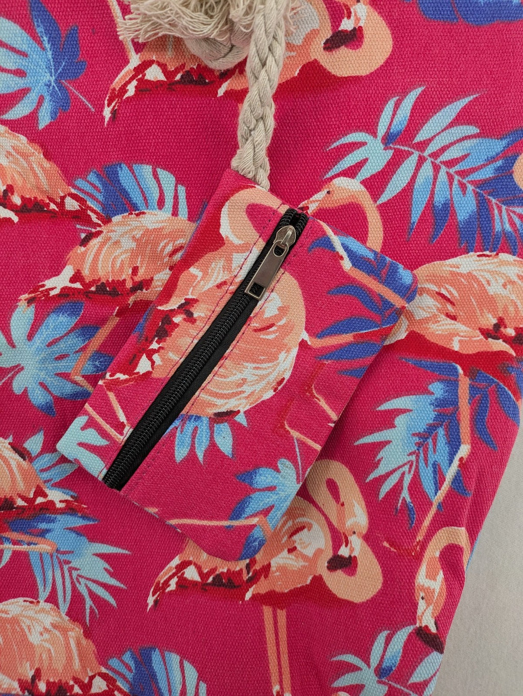 Flamingo pink shopping tote with vibrant tropical flamingo and palm leaf pattern.