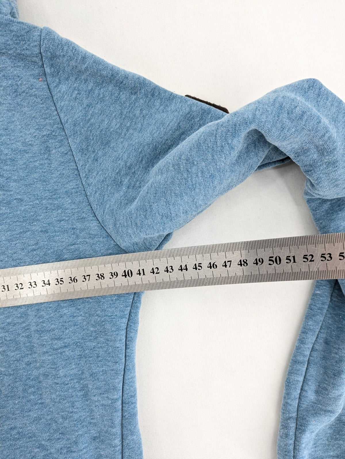 Naketano blue turtle neck jumper with unique collar and artistic leather details
