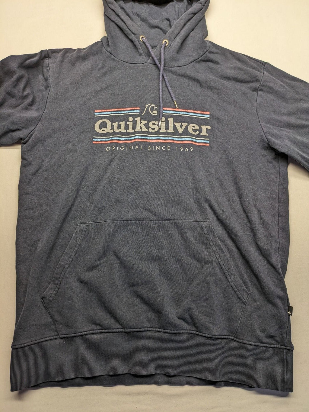 Quiksilver grey hoodie with logo graphic, kangaroo pocket, and adjustable hood.