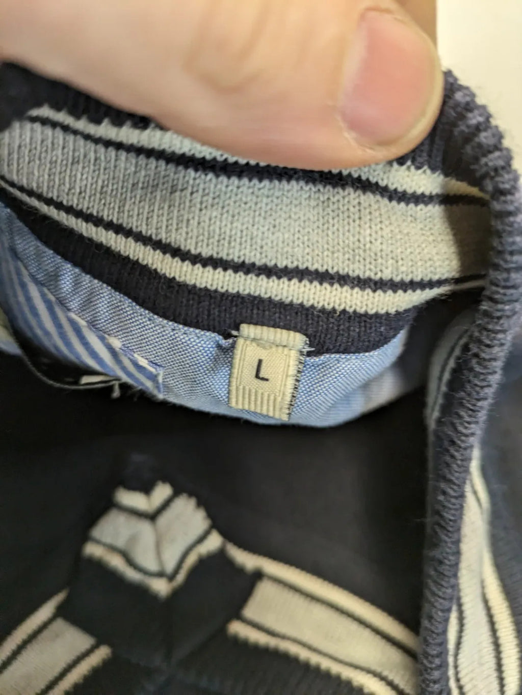 dunmore turtle neck jumper dark blue with striped trims and embroidered crest logo