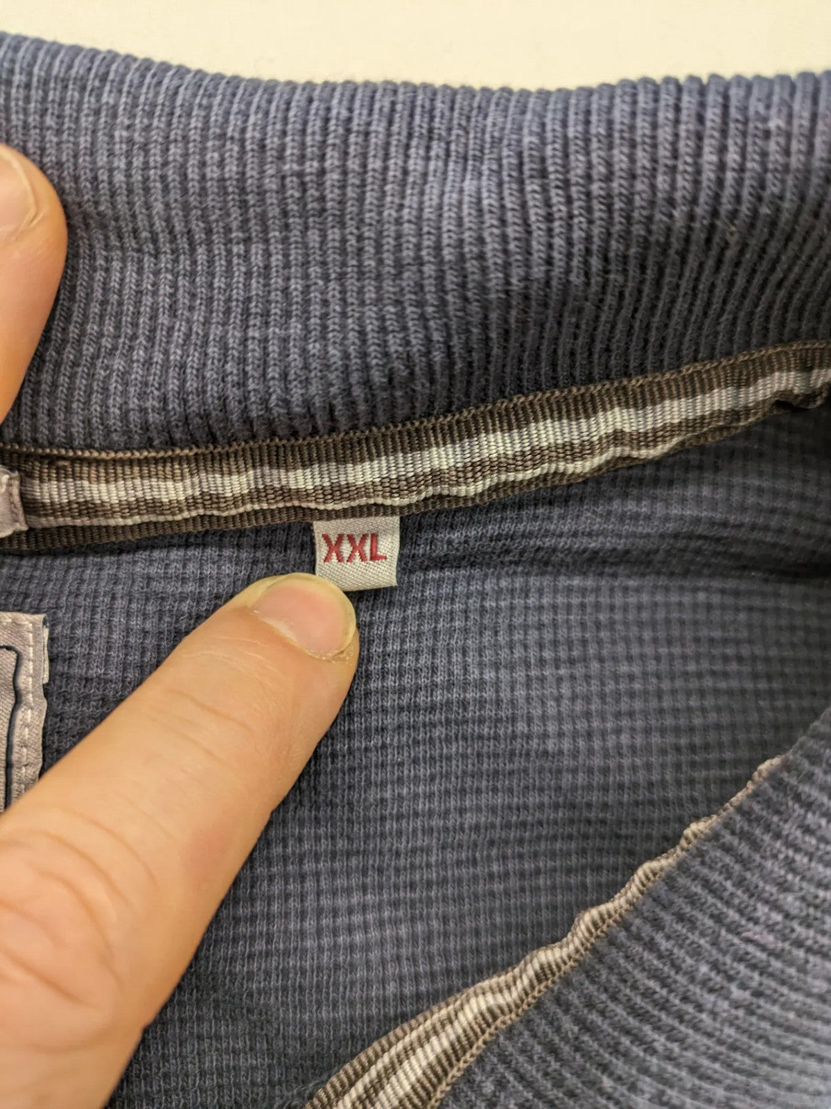 Lerros blue turtle neck jumper with stitched 'British Columbia' detail and button accents.