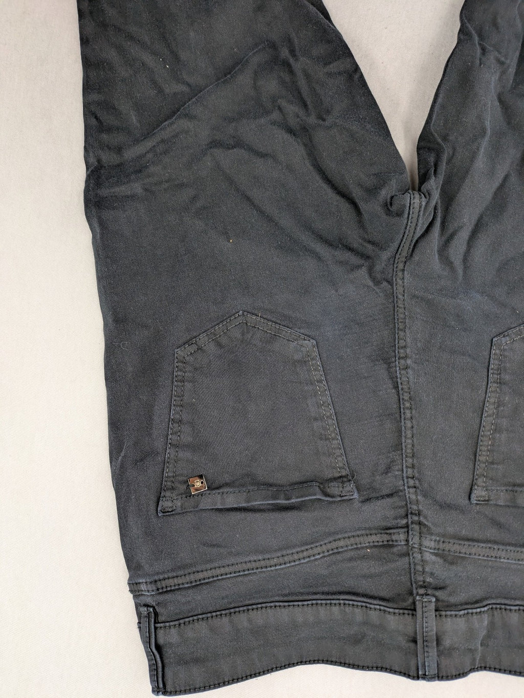 Massimo Dutti grey skinny fit jeans with coated finish and sleek silhouette.