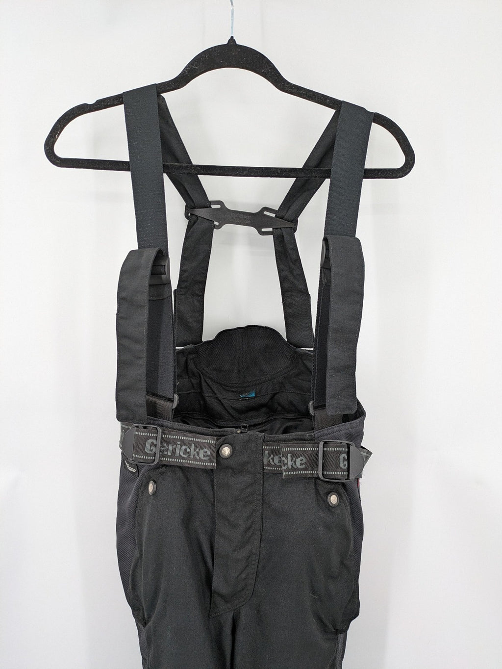 Hein Gericke black chaps with adjustable suspenders, made from durable Cordura and Kevlar.