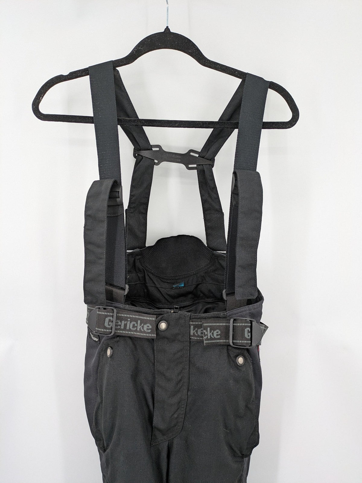 Hein Gericke black chaps with adjustable suspenders, made from durable Cordura and Kevlar.