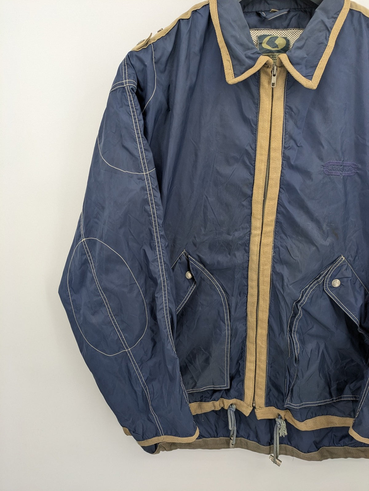 Knock Out navy blue jacket full zip nylon with brown accents and breathable mesh lining.